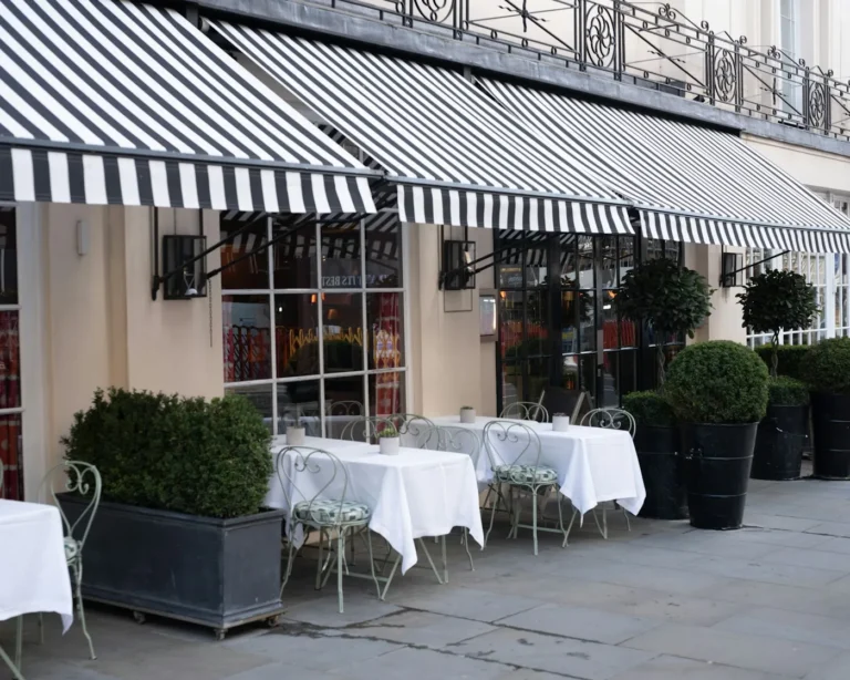 Terrace with striped canvas awnings